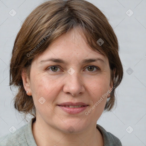 Joyful white adult female with medium  brown hair and grey eyes