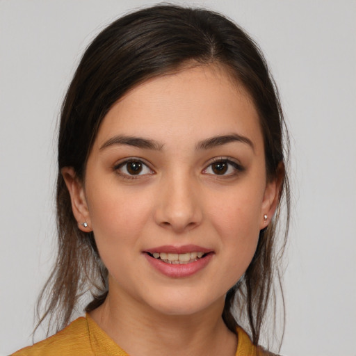 Joyful white young-adult female with medium  brown hair and brown eyes