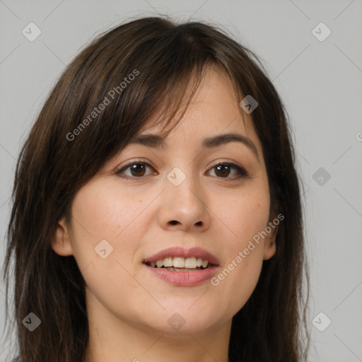 Joyful white young-adult female with long  brown hair and brown eyes