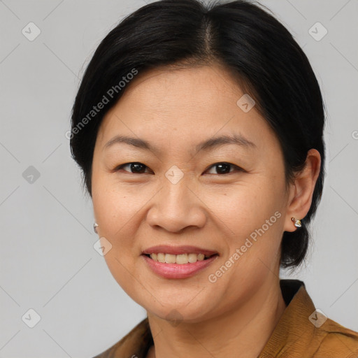 Joyful asian adult female with short  brown hair and brown eyes