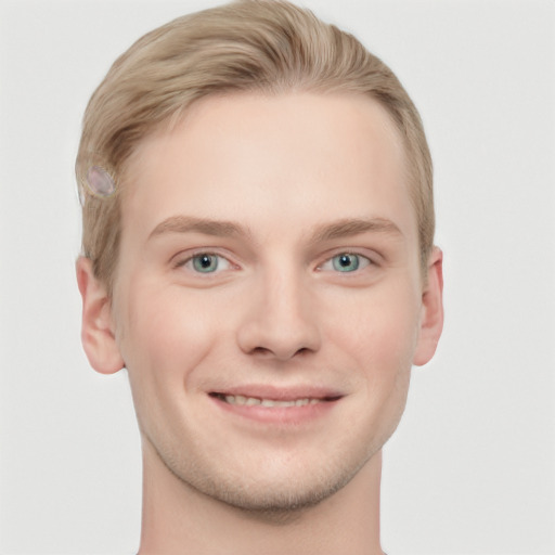 Joyful white young-adult male with short  brown hair and blue eyes