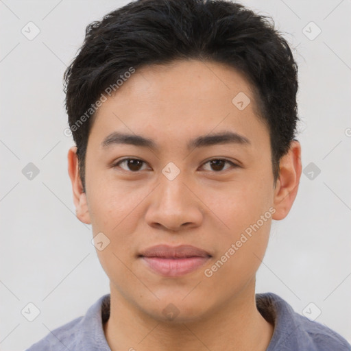 Joyful asian young-adult male with short  brown hair and brown eyes