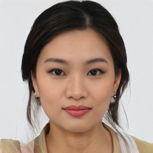 Joyful asian young-adult female with medium  brown hair and brown eyes