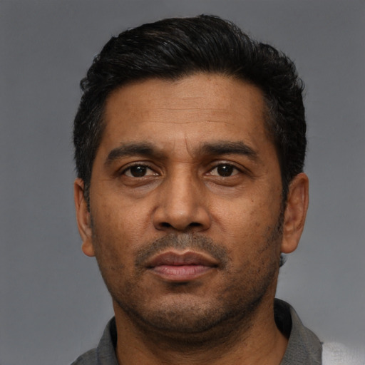 Neutral black adult male with short  black hair and brown eyes