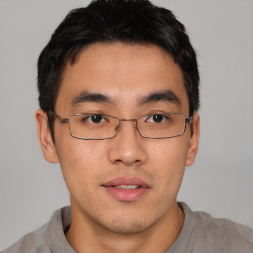 Neutral asian young-adult male with short  brown hair and brown eyes