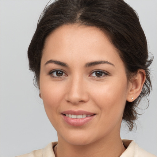 Joyful white young-adult female with medium  brown hair and brown eyes