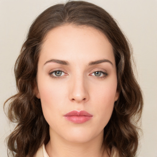 Neutral white young-adult female with medium  brown hair and green eyes