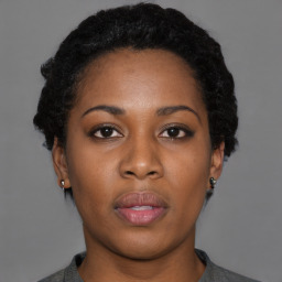 Neutral black young-adult female with short  black hair and brown eyes