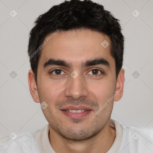 Joyful white young-adult male with short  black hair and brown eyes