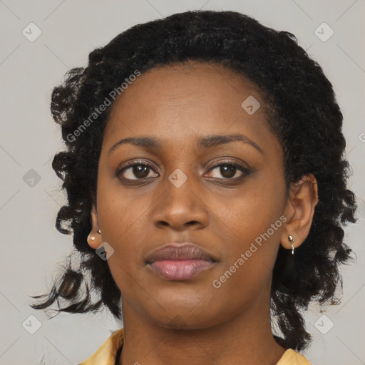 Joyful black young-adult female with medium  black hair and brown eyes