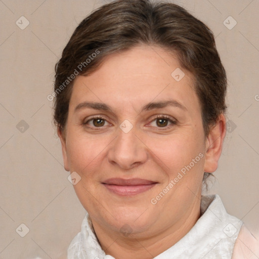 Joyful white adult female with short  brown hair and brown eyes