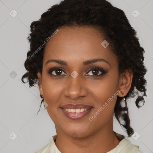 Joyful black young-adult female with medium  brown hair and brown eyes