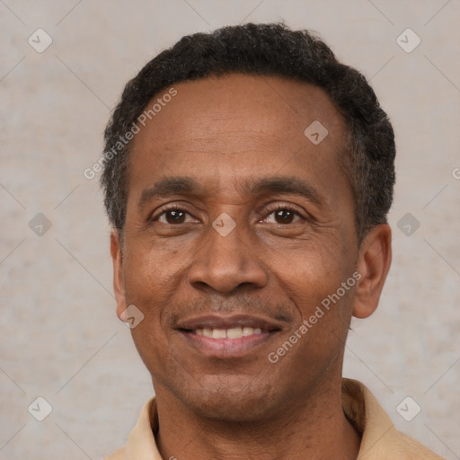 Joyful latino adult male with short  black hair and brown eyes