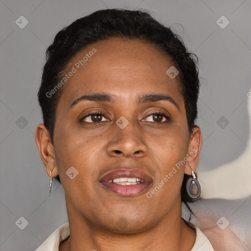 Joyful black adult female with short  brown hair and brown eyes