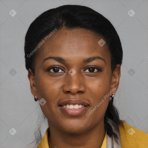 Joyful black young-adult female with short  black hair and brown eyes