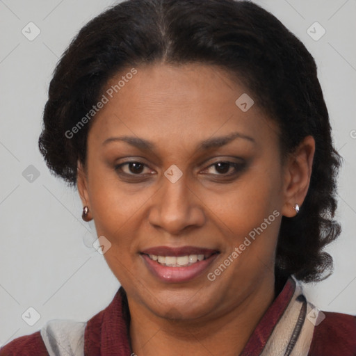 Joyful black adult female with medium  brown hair and brown eyes