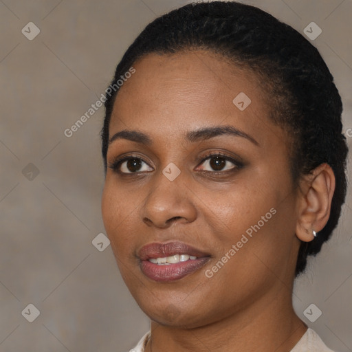 Joyful black young-adult female with short  brown hair and brown eyes