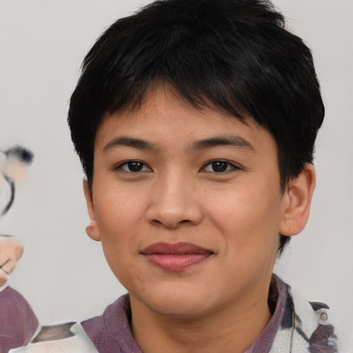 Joyful asian young-adult female with short  brown hair and brown eyes