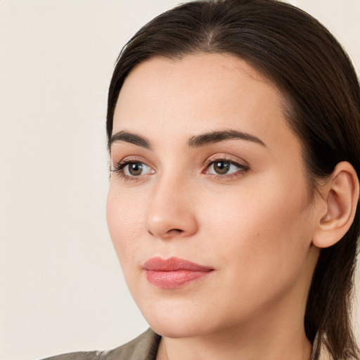 Neutral white young-adult female with long  brown hair and brown eyes