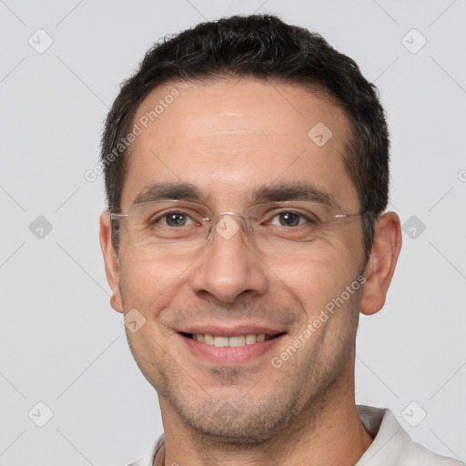 Joyful white adult male with short  brown hair and brown eyes