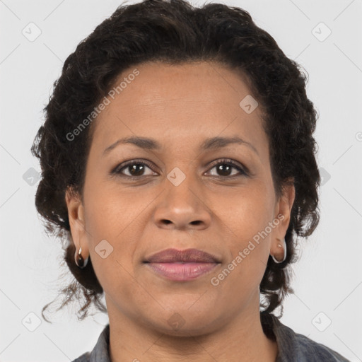 Joyful latino adult female with medium  brown hair and brown eyes