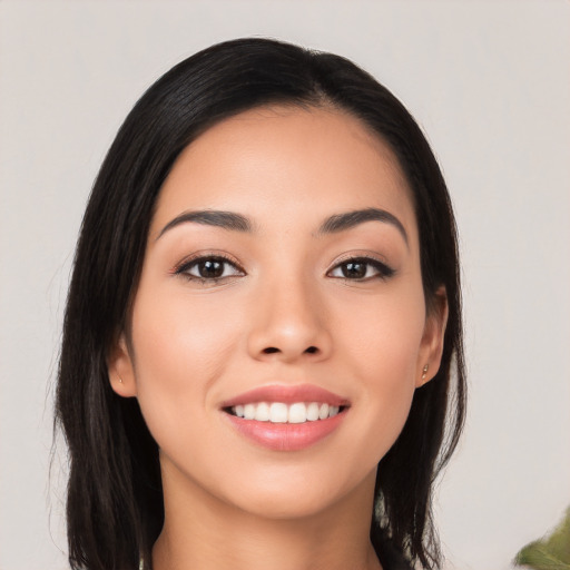 Joyful asian young-adult female with long  black hair and brown eyes