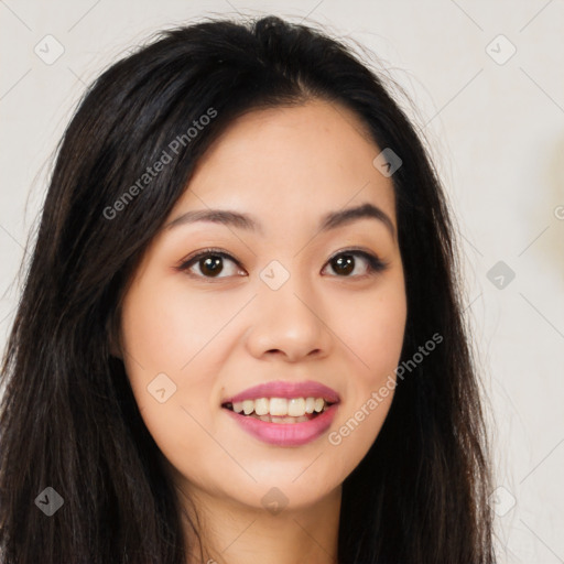 Joyful asian young-adult female with long  brown hair and brown eyes