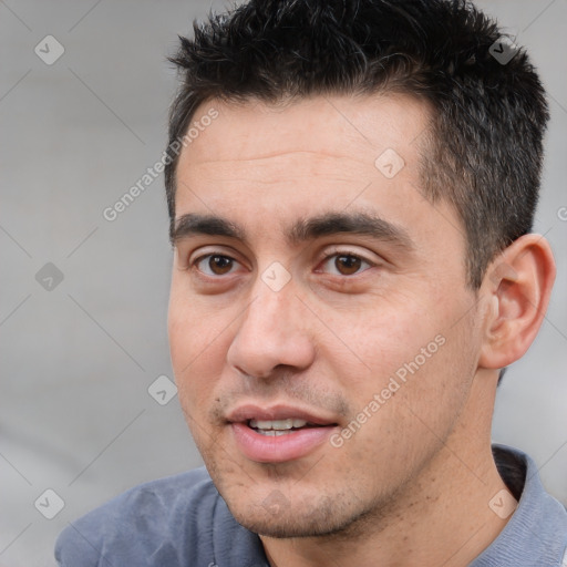 Joyful white adult male with short  brown hair and brown eyes