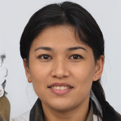 Joyful asian young-adult female with medium  black hair and brown eyes