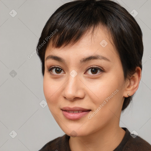 Joyful asian young-adult female with medium  brown hair and brown eyes