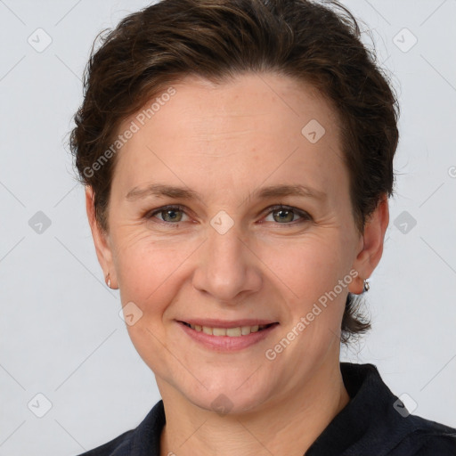 Joyful white adult female with short  brown hair and brown eyes