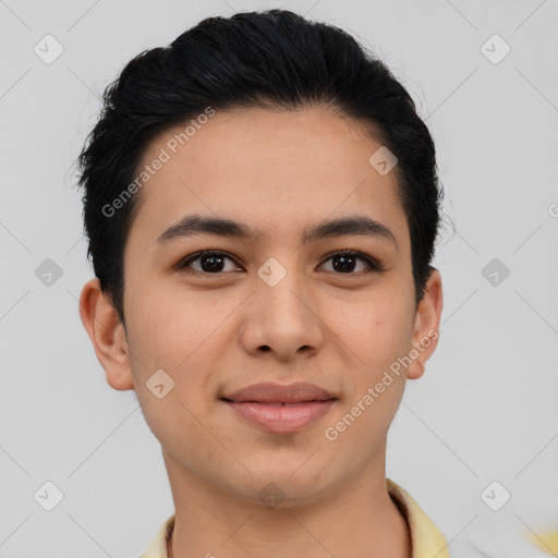 Joyful latino young-adult male with short  brown hair and brown eyes