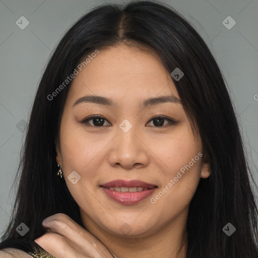 Joyful latino young-adult female with long  brown hair and brown eyes