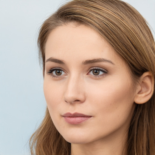 Neutral white young-adult female with long  brown hair and brown eyes