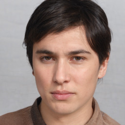 Neutral white young-adult male with medium  brown hair and brown eyes