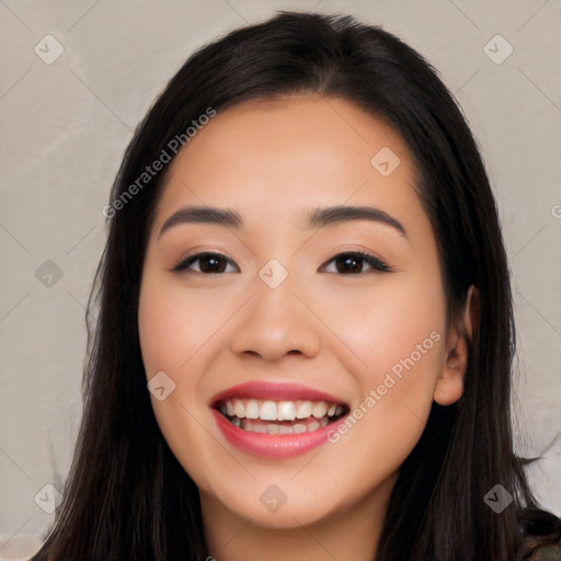 Joyful white young-adult female with long  black hair and brown eyes