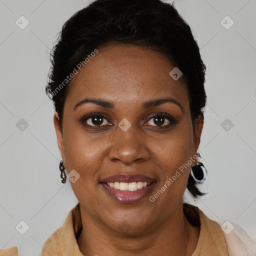 Joyful black young-adult female with short  brown hair and brown eyes