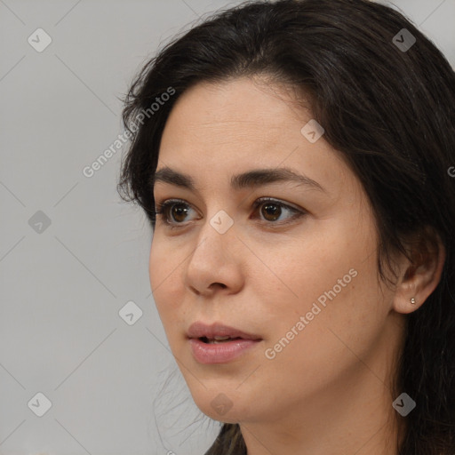 Neutral white young-adult female with long  brown hair and brown eyes