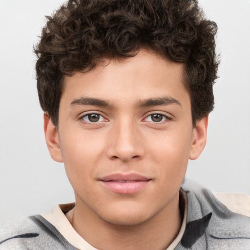 Joyful white child male with short  brown hair and brown eyes