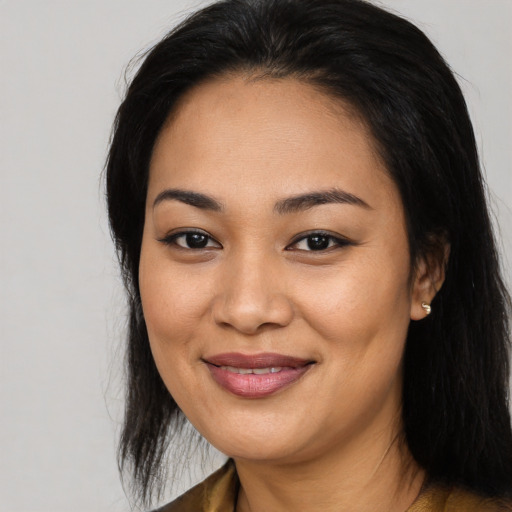 Joyful asian young-adult female with long  black hair and brown eyes