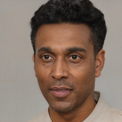Neutral latino adult male with short  black hair and brown eyes