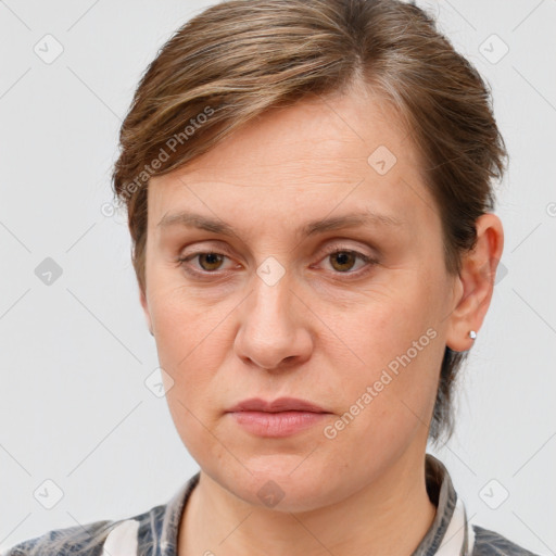 Joyful white adult female with short  brown hair and grey eyes