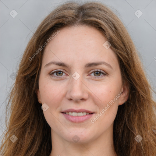 Joyful white young-adult female with long  brown hair and green eyes