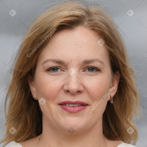 Joyful white adult female with medium  brown hair and grey eyes