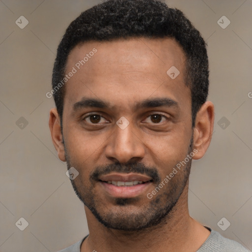 Joyful black young-adult male with short  black hair and brown eyes