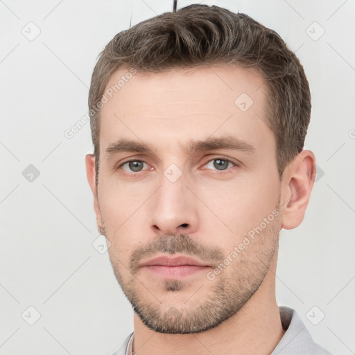 Neutral white young-adult male with short  brown hair and grey eyes