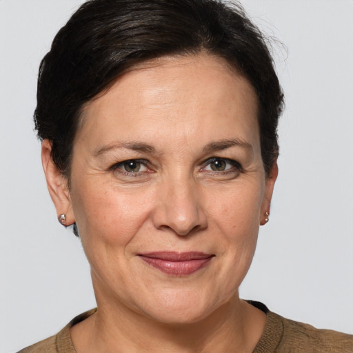 Joyful white adult female with short  brown hair and grey eyes