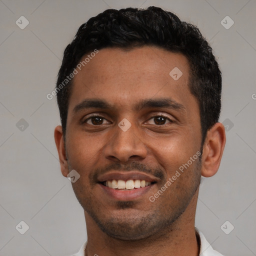 Joyful latino young-adult male with short  black hair and brown eyes