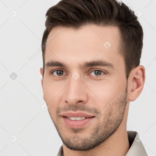 Joyful white young-adult male with short  brown hair and brown eyes