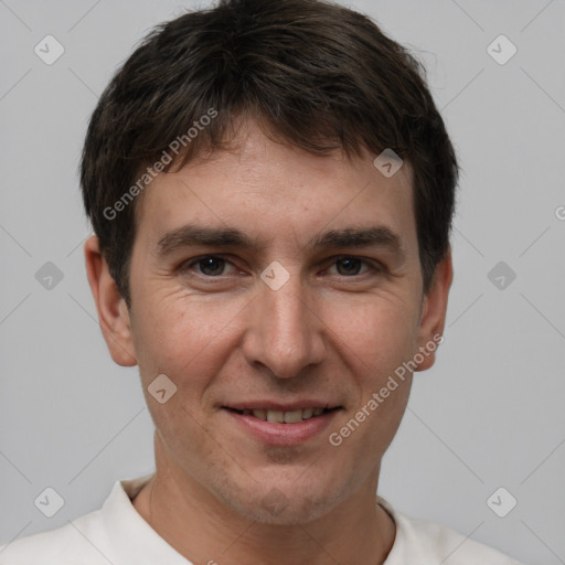 Joyful white adult male with short  brown hair and brown eyes